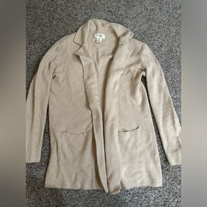 Sweater/jacket, professional or business casual.